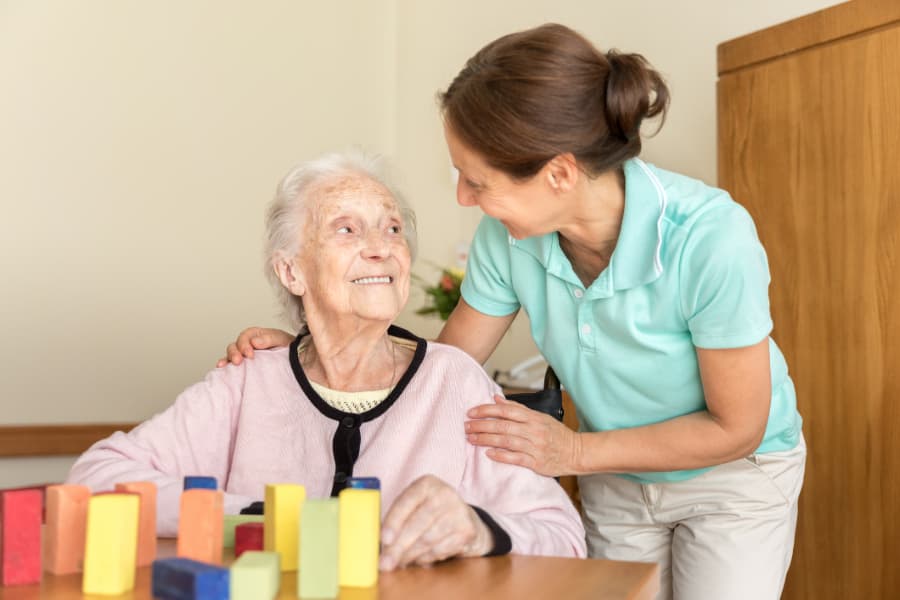 Home caregiver and senior adult resident